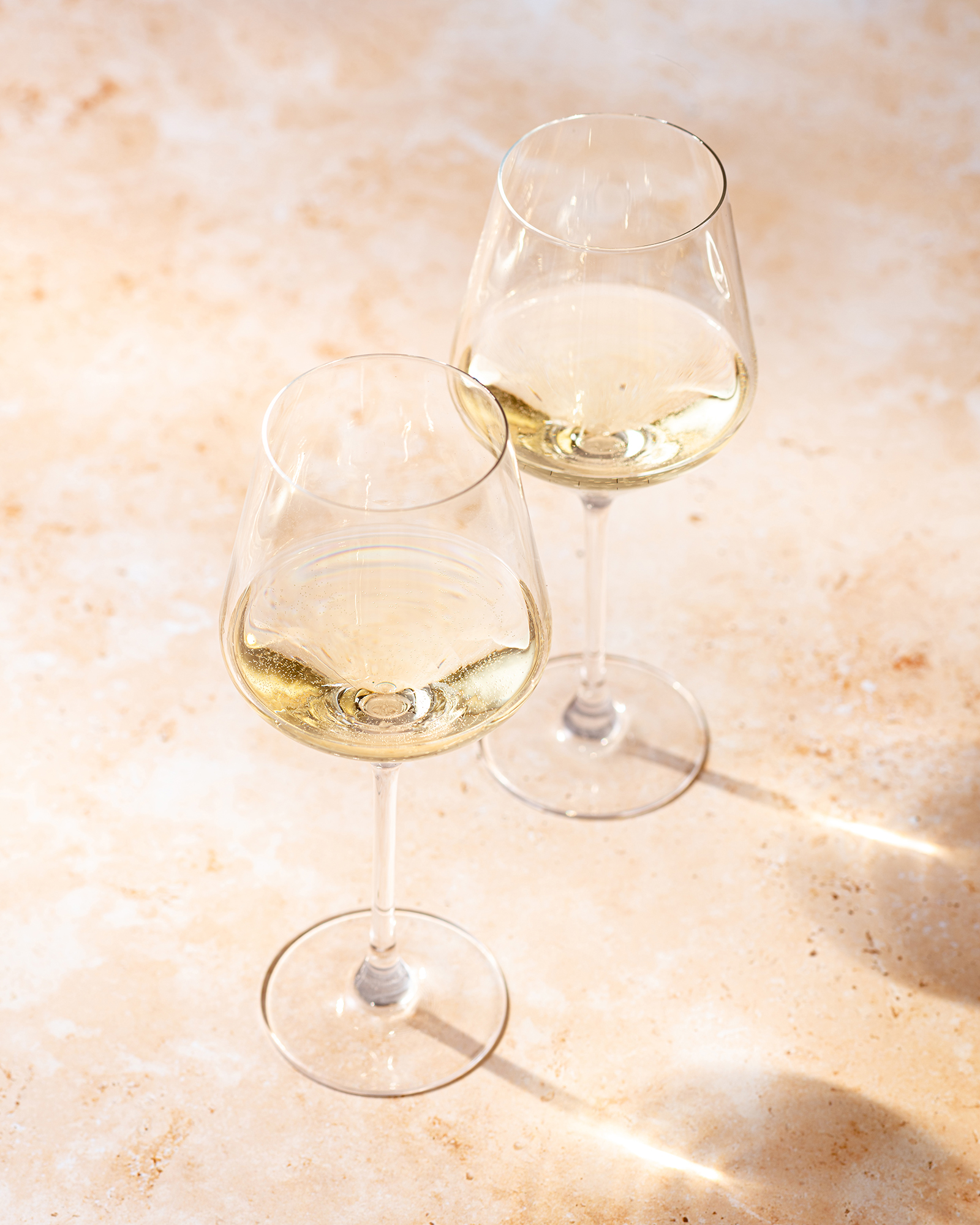 white-wine-glasses-on-stone
